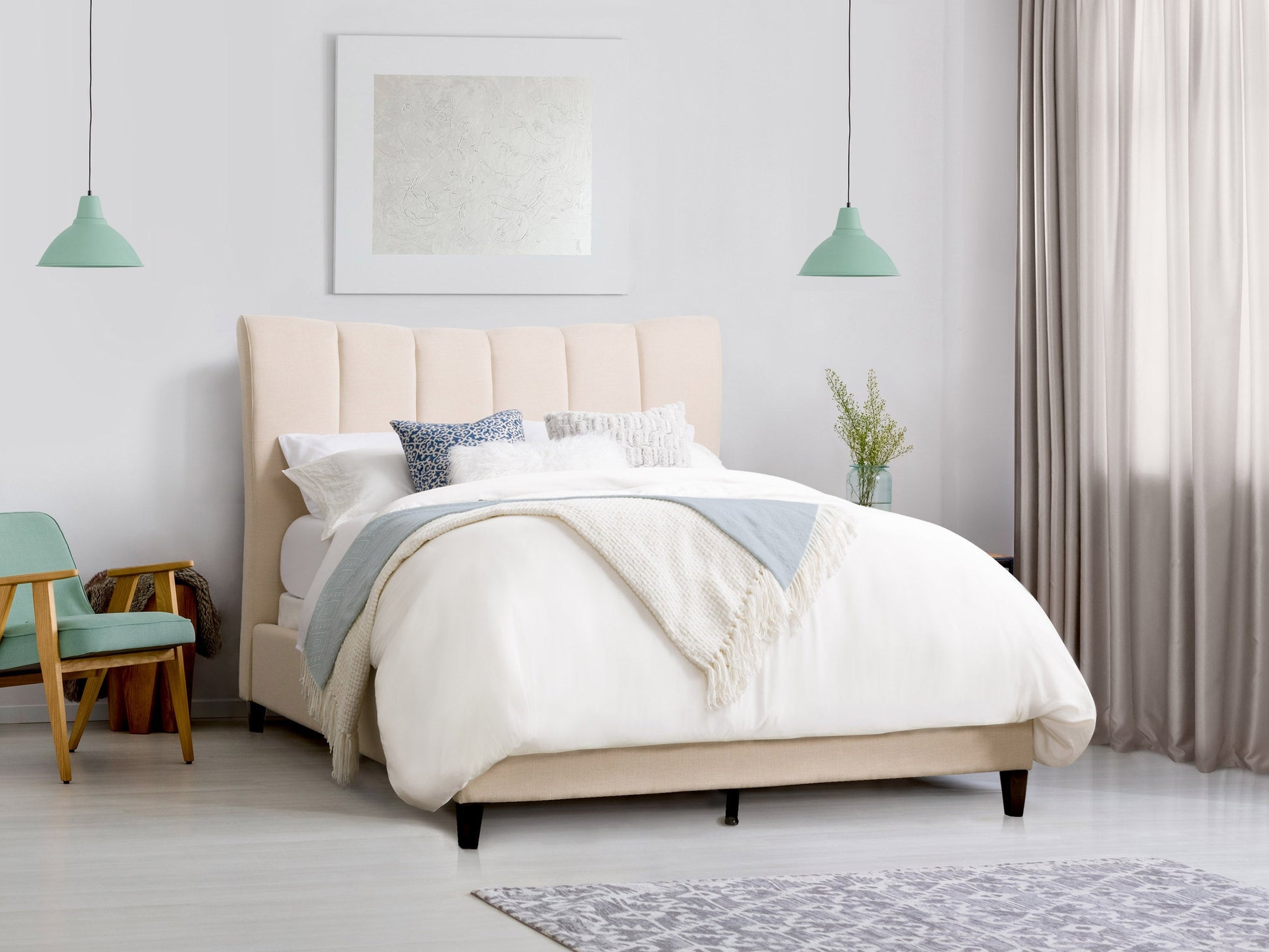 Cream channel tufted double/full bed with plush upholstery, sleek wooden legs, and elegant vertical stitching. Perfect for modern bedrooms seeking a blend of comfort and sophistication.