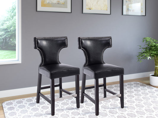 Black counter height bar stools, set of 2, featuring sleek metal frames, cushioned seats in faux leather, and footrests for added comfort. Ideal for modern kitchens, home bars, or dining areas.