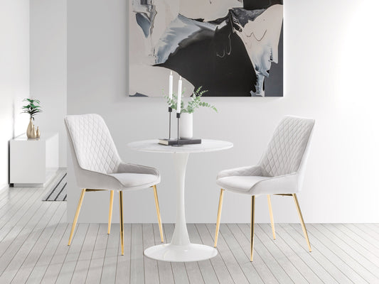 Light grey velvet dining chairs, set of 2, with tufted backrest, gold metal legs, and contemporary design. Perfect for modern dining rooms or kitchens. Luxurious and elegant seating solution.