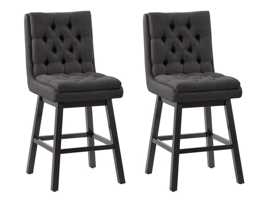 Dark grey button tufted bar stools with wooden legs and footrest, featuring plush fabric upholstery and a classic design, perfect for modern and contemporary kitchen or bar settings.