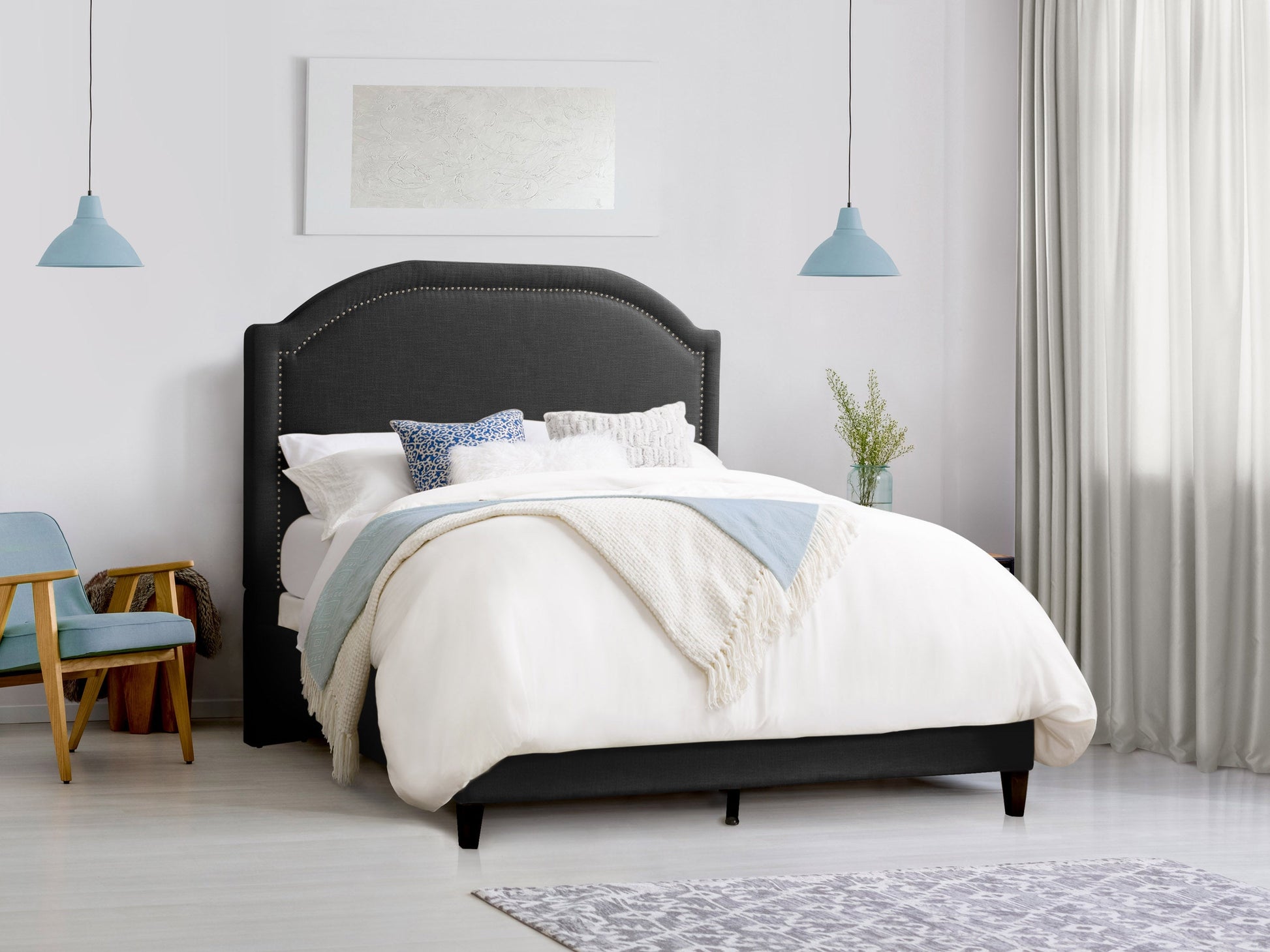 Dark grey upholstered king bed with tufted headboard, sturdy wooden frame, and plush fabric finish. Ideal for modern bedrooms, combining comfort and style with a sleek, contemporary design.