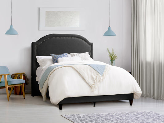 Dark grey upholstered queen bed with tufted headboard, soft fabric texture, and sturdy wooden frame. Ideal for modern bedrooms, offering comfort and style.