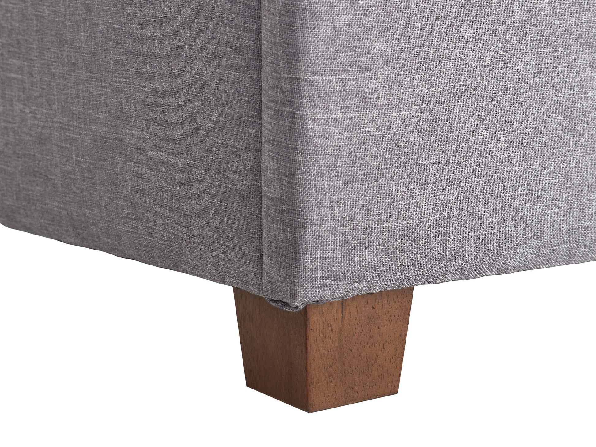 Light grey large storage ottoman with tufted top, soft fabric upholstery, and wooden legs. Ideal for living rooms or bedrooms, providing extra seating and hidden storage space.