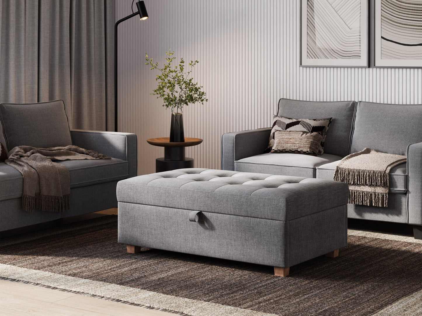 Light grey large storage ottoman with tufted top, soft fabric upholstery, and wooden legs. Ideal for living rooms or bedrooms, providing extra seating and hidden storage space.
