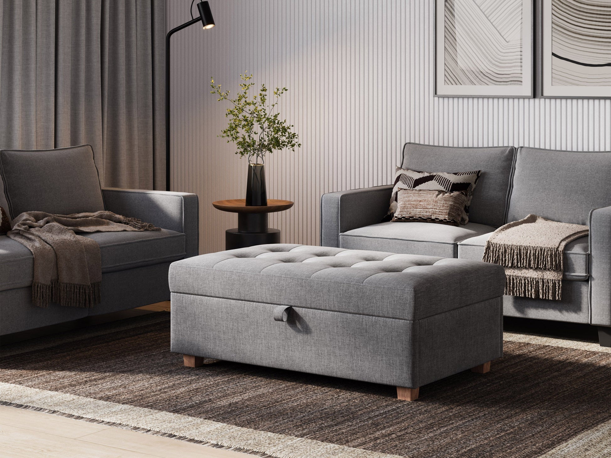 Light grey large storage ottoman with tufted top, soft fabric upholstery, and wooden legs. Ideal for living rooms or bedrooms, providing extra seating and hidden storage space.