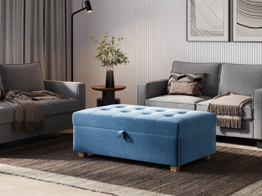 Blue large storage ottoman with tufted top, upholstered in soft fabric, featuring spacious interior storage and sturdy wooden legs, perfect for living room or bedroom organization and seating.