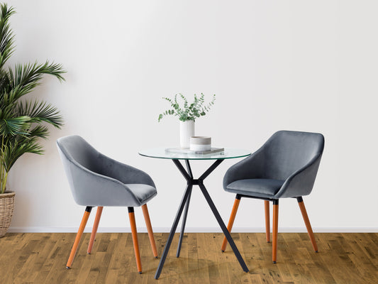 Set of 2 grey velvet dining chairs with tufted backs, sleek black metal legs, and plush cushioning for modern dining rooms.