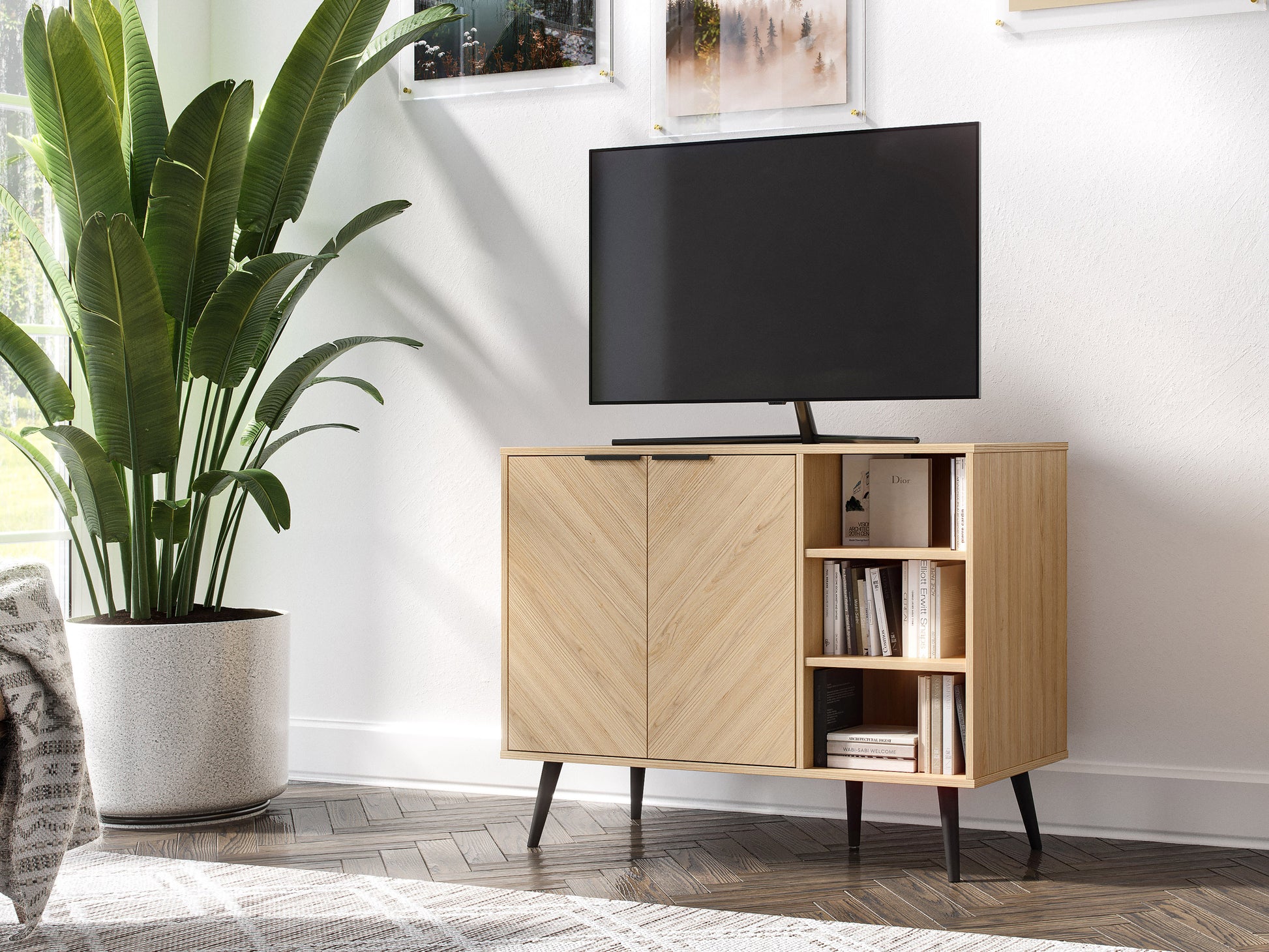 Modern sideboard buffet in light wood finish with black metal legs, featuring four cabinet doors with sleek handles and a spacious top surface for decor or storage.