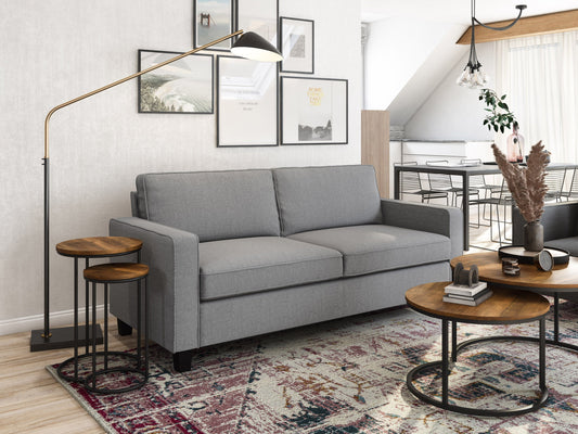 Light grey 3-seater sofa with plush cushions, wooden legs, and soft fabric upholstery. Ideal for modern living rooms, this stylish couch offers comfort and elegance, perfect for family gatherings or relaxation.