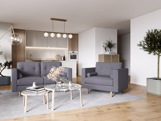 Grey mid-century modern arm chair with wooden legs, upholstered in soft fabric, featuring a tufted backrest and sleek armrests, perfect for living room or office decor.