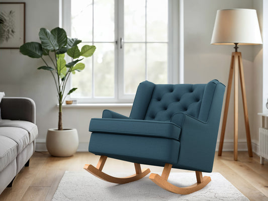 Blue wooden rocking chair with curved armrests, slatted backrest, and cushioned seat. Ideal for living rooms and nurseries. Classic design with a smooth finish, perfect for relaxation and home decor.