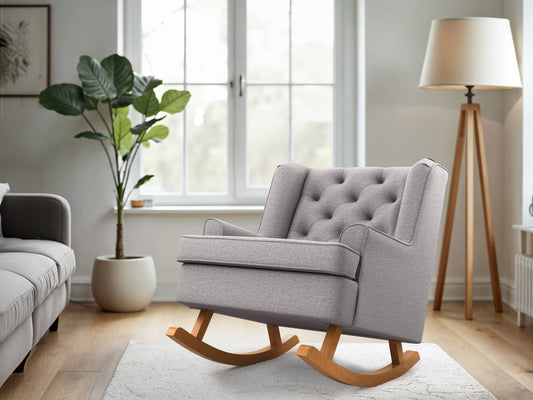 Light grey upholstered rocking chair with wooden legs, featuring a high back and cushioned seat for comfort. Ideal for living rooms and nurseries, blending modern design with timeless elegance.