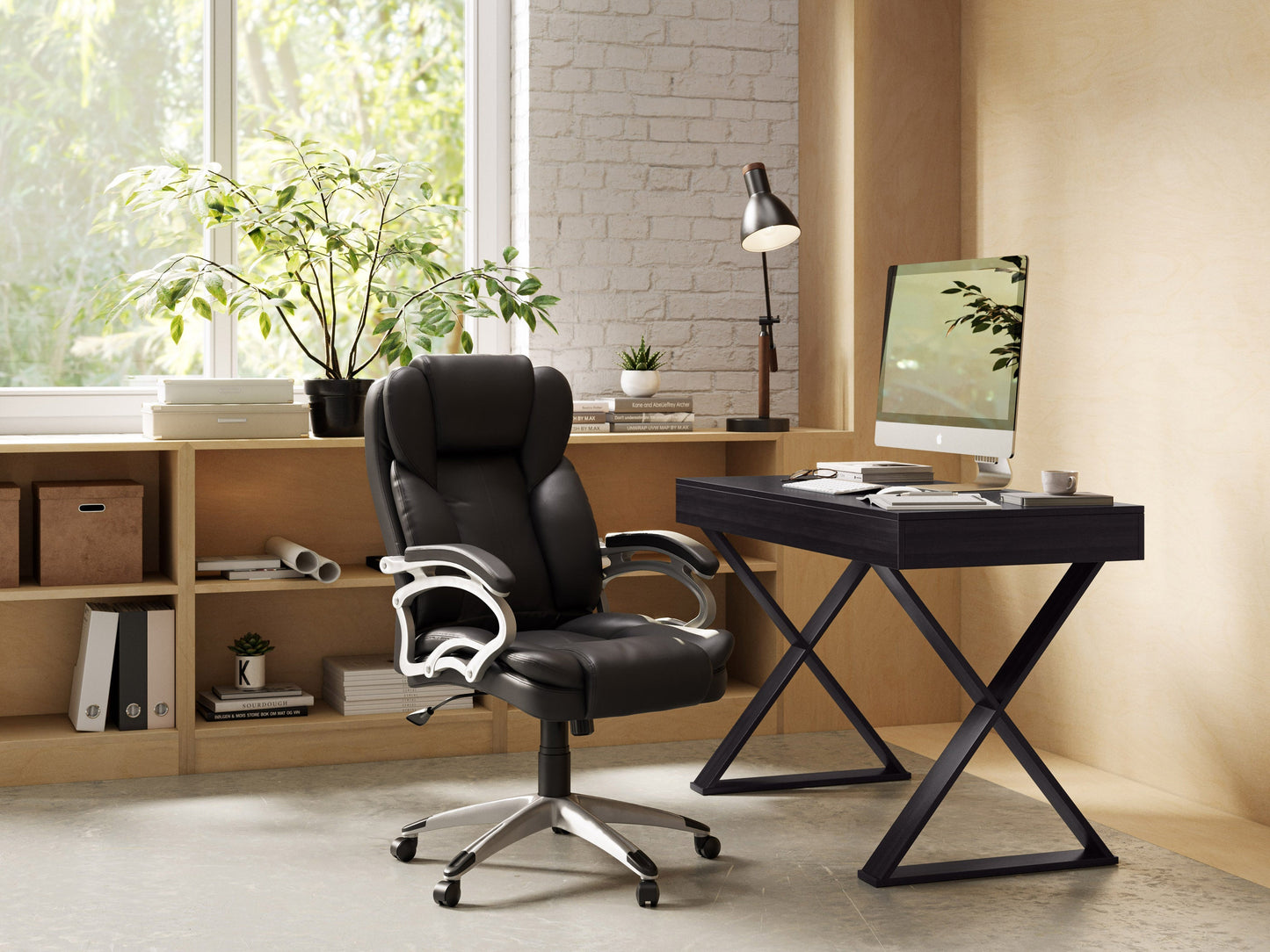 Ergonomic black leather executive office chair with padded armrests, high back support, adjustable height, and swivel base, ideal for home or corporate office setups.