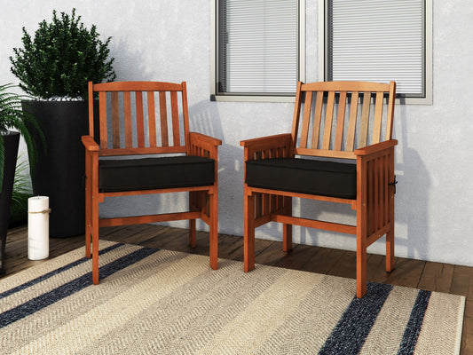 Brown wooden patio armchair set of 2 with slatted backrests, armrests, and cushioned seats, perfect for outdoor use. Durable teak wood construction with natural finish, ideal for garden, porch, or balcony seating.