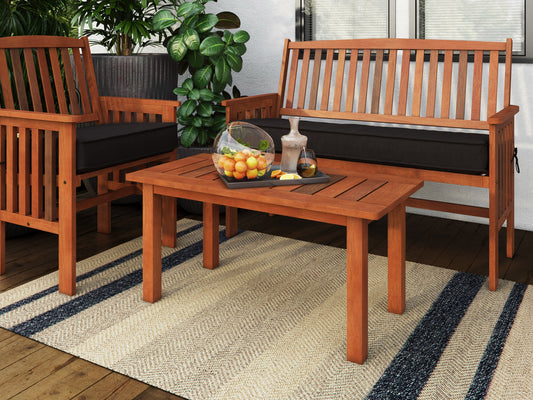 Brown hardwood outdoor coffee table with slatted top and sturdy legs, ideal for patio or garden use. Durable wood construction with natural grain texture, perfect for outdoor gatherings and relaxation.