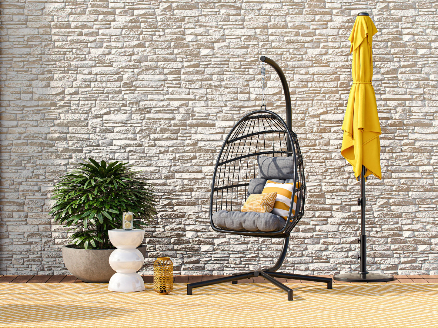 Grey hanging egg chair with plush cushions, woven rattan texture, and sturdy metal frame. Ideal for patios, this patio swing features a comfortable, cocoon-like design perfect for outdoor relaxation.