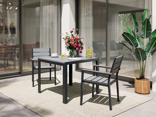 Square outdoor dining table with weather-resistant gray wicker frame, tempered glass top, and sturdy metal legs, perfect for patio or garden settings. Ideal for outdoor dining and entertaining.