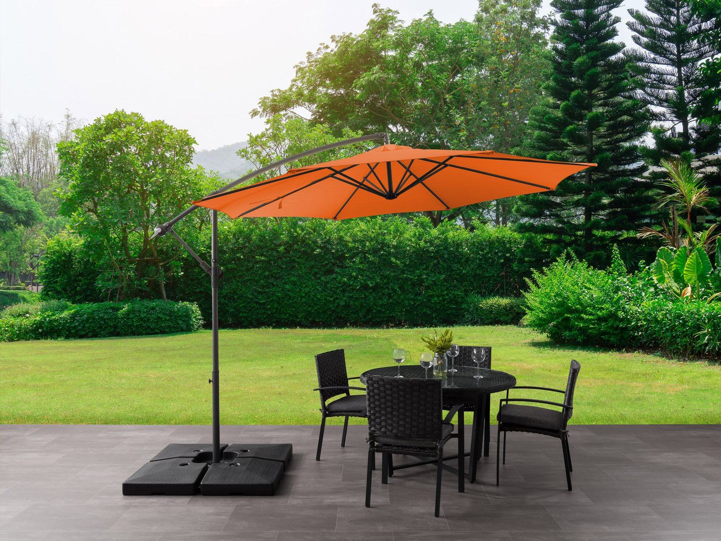 Orange 9.5ft tilting offset patio umbrella with sturdy aluminum frame, UV-resistant canopy, and easy-to-operate crank lift system, perfect for outdoor shade and patio decor.