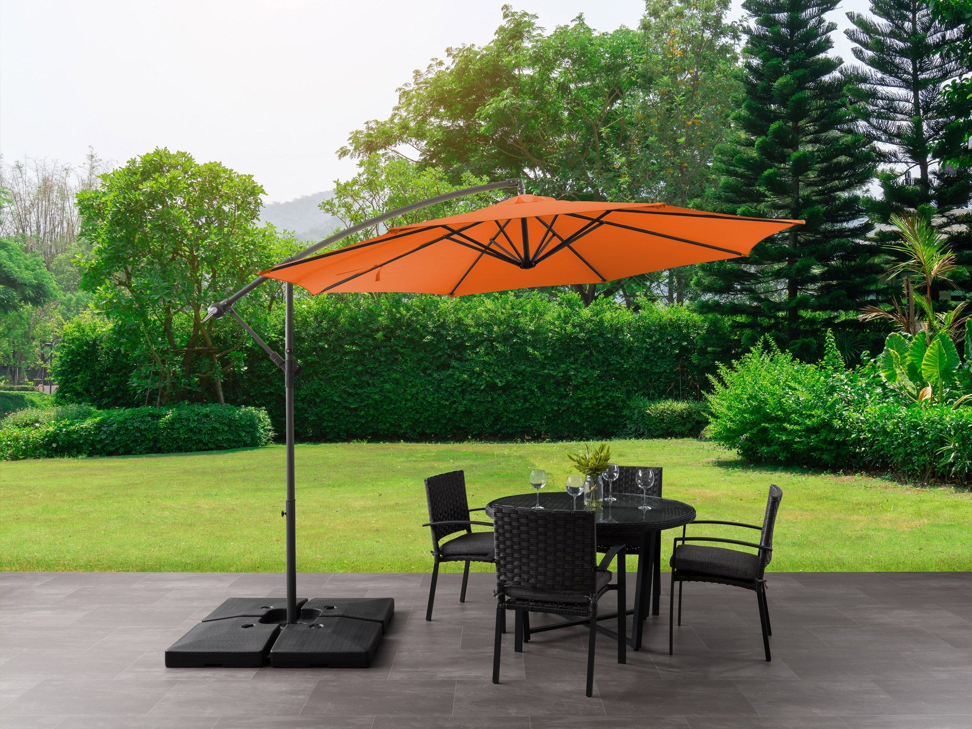 Orange 9.5ft tilting offset patio umbrella with sturdy aluminum frame, UV-resistant canopy, and easy-to-operate crank lift system, perfect for outdoor shade and patio decor.