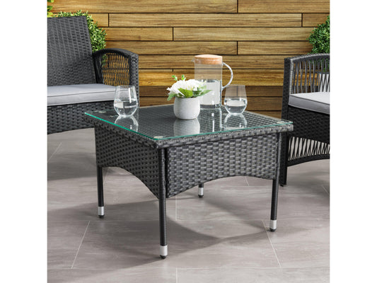 Outdoor wicker side table with glass top, featuring a sturdy metal frame and intricate wicker pattern in brown. Ideal for patio or garden use, offering a stylish and durable addition to outdoor furniture sets.