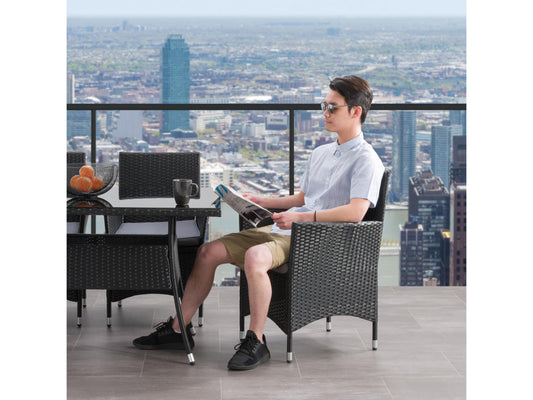 Set of two wicker patio armchairs with beige cushions, featuring a sturdy metal frame and woven rattan design, perfect for outdoor seating and garden decor.