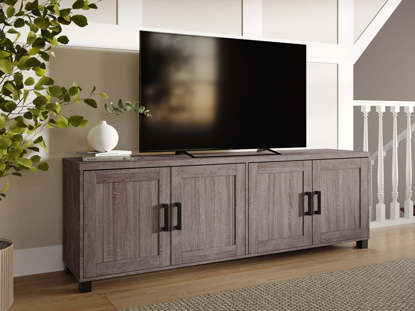 Brown wooden TV stand with doors, suitable for TVs up to 85 inches. Features a sleek design with ample storage space, including two cabinets and open shelving, perfect for living room organization.
