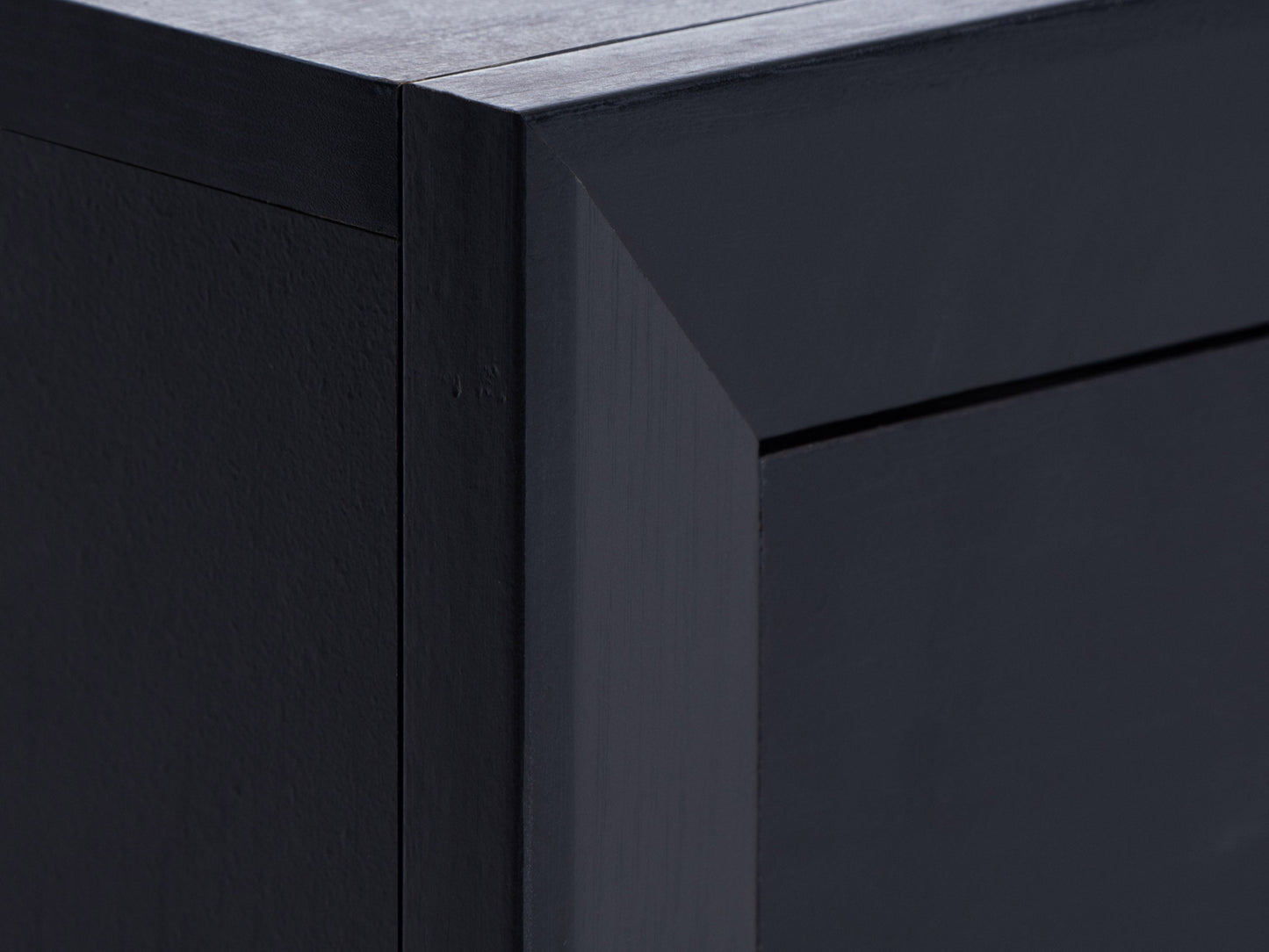 Black TV stand for TVs up to 85 inches, featuring sleek black finish, sturdy metal frame, tempered glass shelves, and cable management system. Ideal for modern living rooms and home theaters.