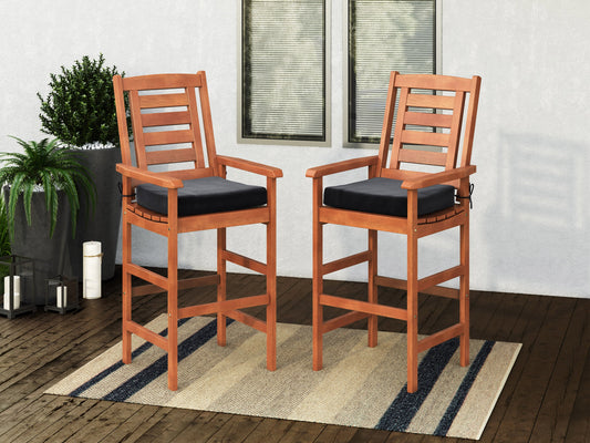 Set of 2 wooden patio bar stools with natural finish, featuring slatted backs, grey cushioned seats, and sturdy armrests, perfect for outdoor dining and entertaining.