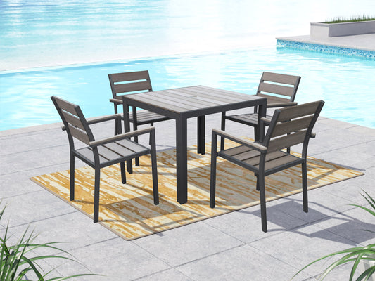Set of four patio dining chairs with sleek black metal frames and light gray cushions, featuring a modern design with slatted backrests and weather-resistant materials ideal for outdoor use.