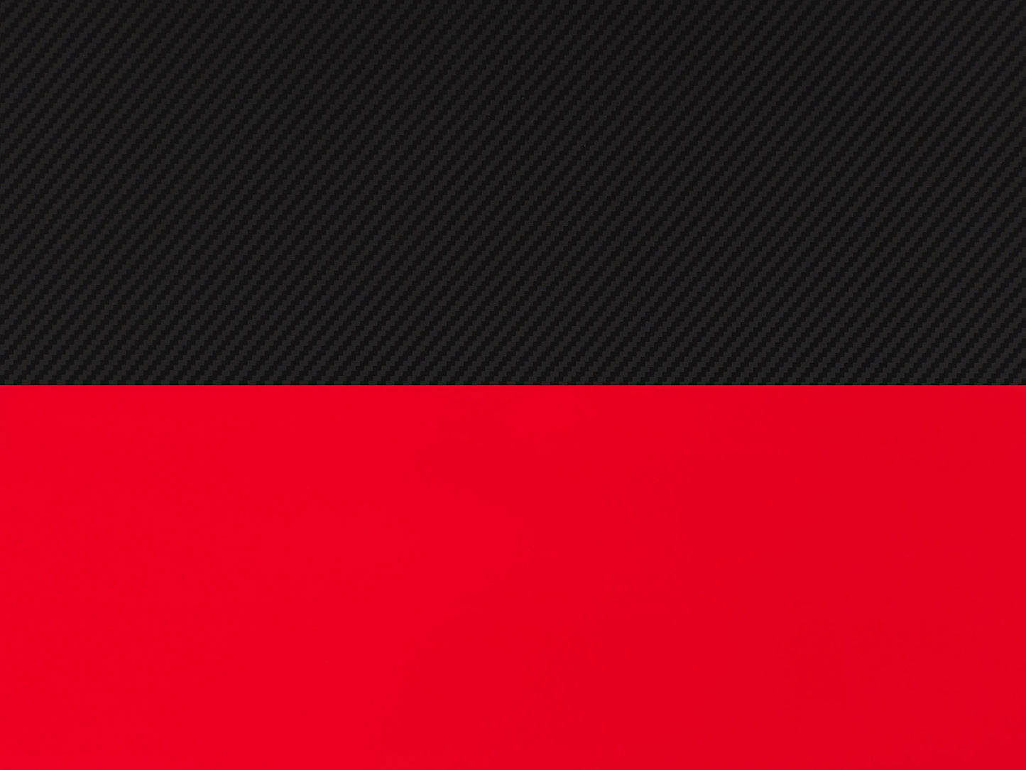 Red and black gaming desk with carbon fiber texture, ergonomic design, built-in cable management, and sturdy metal frame. Ideal for gamers seeking a stylish and functional workspace.