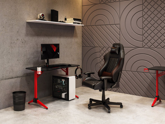 Red and black gaming desk with sleek metal frame, spacious carbon fiber textured surface, built-in cup holder, headphone hook, and cable management system. Ideal for gamers seeking style and functionality.