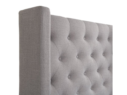 Tufted king bed with slats in grey fabric, featuring a plush, button-tufted headboard, wooden frame, and sturdy slats for mattress support. Ideal for modern bedrooms seeking a stylish and comfortable centerpiece.