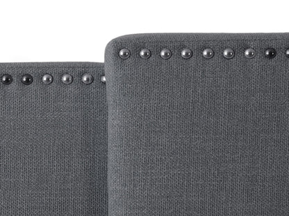 Dark grey adjustable headboard with tufted upholstery, sleek design, and soft fabric texture, suitable for queen and king size beds. Ideal for modern bedroom decor, offering customizable height settings.