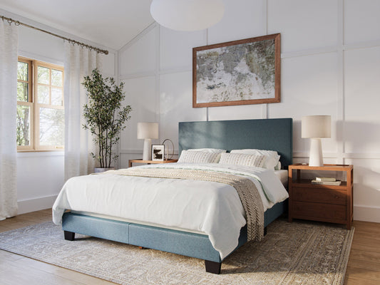 Modern queen bed with blue upholstered headboard, sleek wooden frame, and minimalist design. Features soft fabric texture and sturdy construction, perfect for contemporary bedroom decor.
