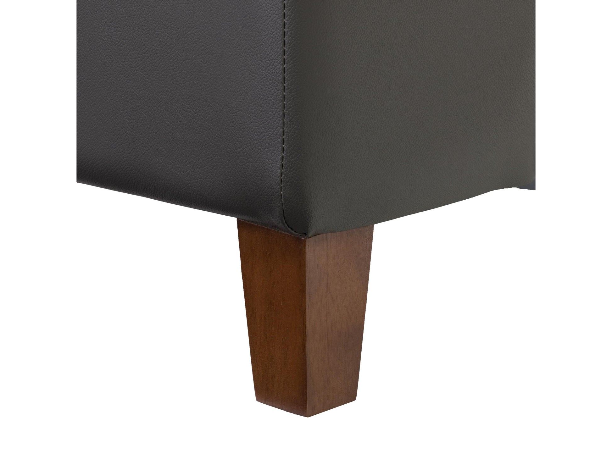 Brown leather arm chair with tufted backrest, dark wooden legs, and brass nailhead trim, ideal for living room or office decor.