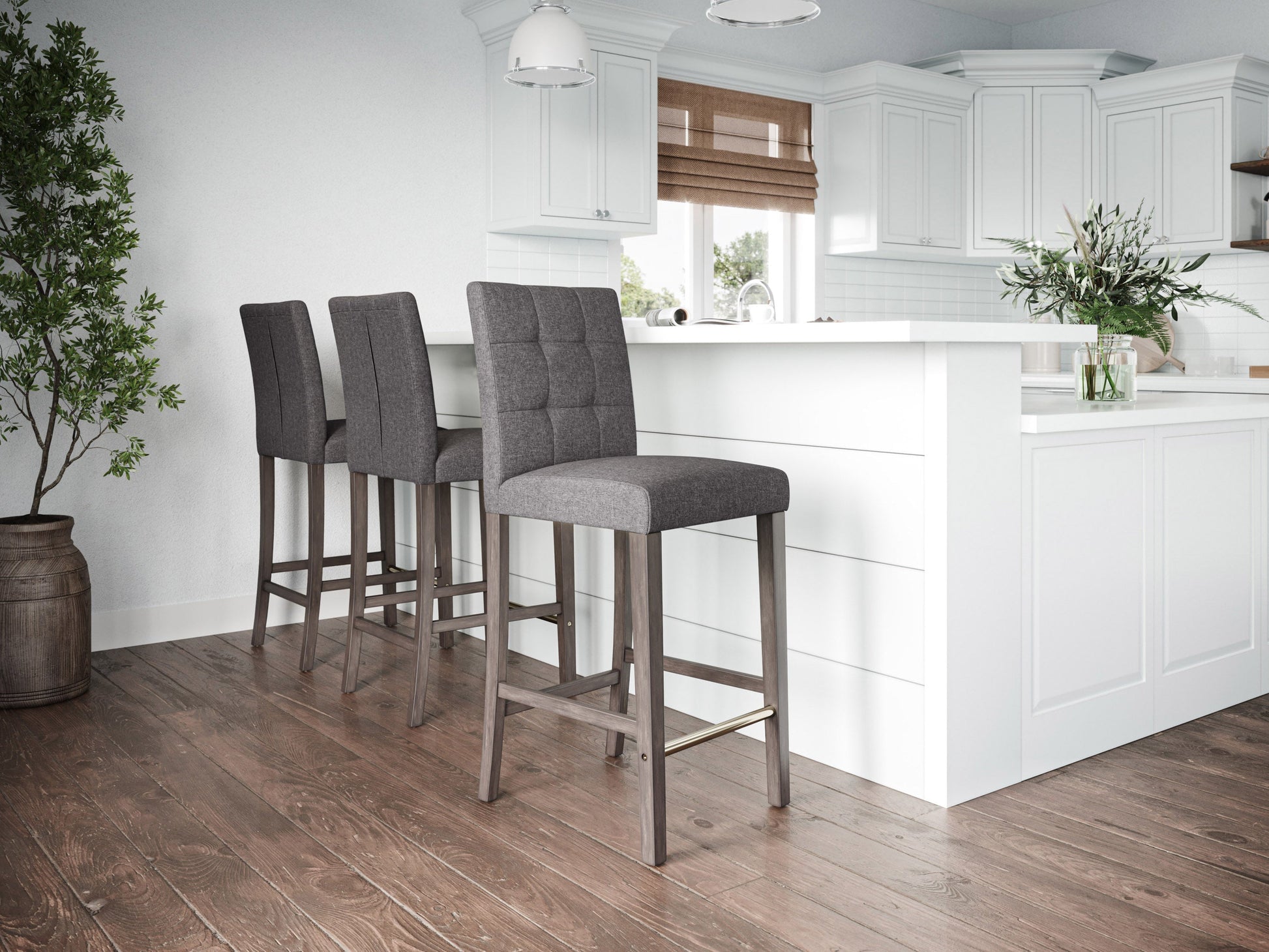 Silver grey bar height stool with cushioned fabric seat, sleek metal legs, and footrest. Ideal for modern kitchens or bars, this stool combines comfort and contemporary design.