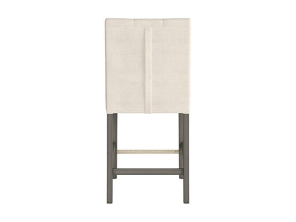 Beige fabric counter height bar stool with cushioned seat, dark wooden legs, and footrest. Ideal for kitchen islands and home bars. Modern design with a comfortable backrest and durable upholstery.