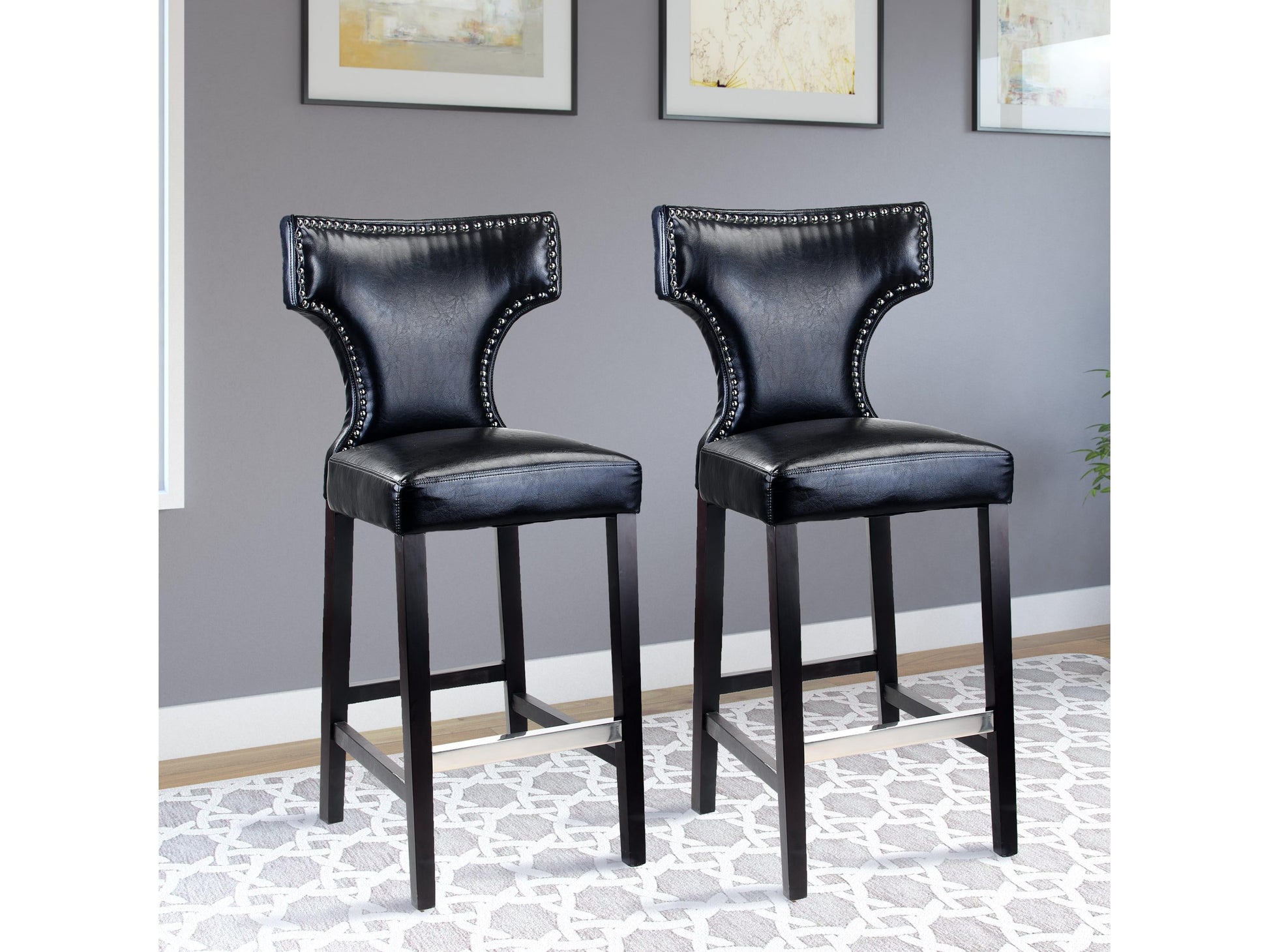 Set of 2 black bar height bar stools with sleek metal frames, cushioned seats, and footrests. Modern design with durable materials ideal for kitchen islands or home bars.