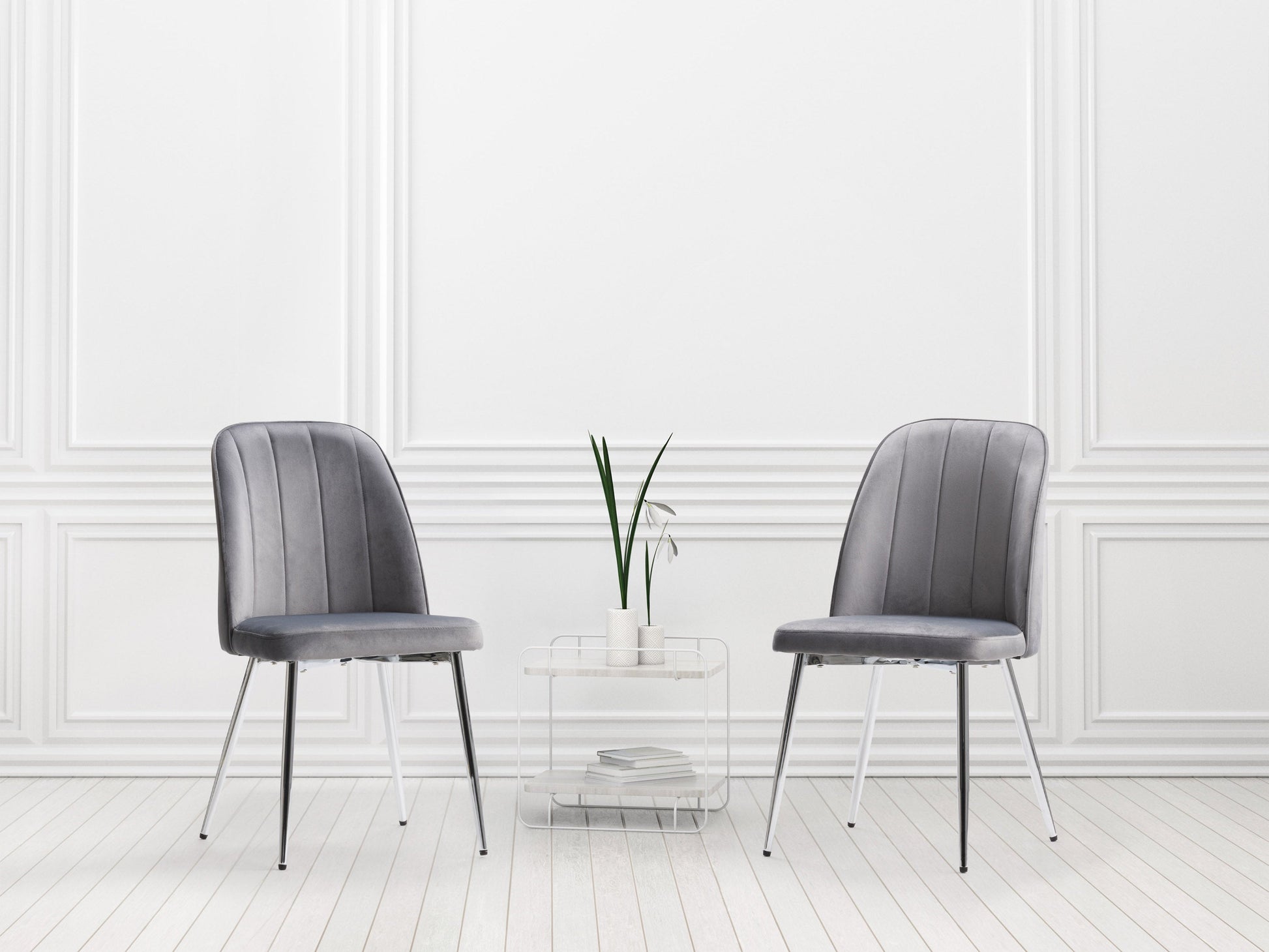 Grey velvet dining room chairs, set of 2, featuring sleek metal legs, plush upholstery, and a modern design. Ideal for contemporary dining spaces, these chairs offer both comfort and style.