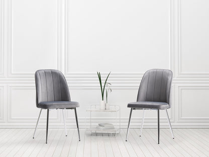 Grey velvet dining room chairs, set of 2, featuring sleek metal legs, plush upholstery, and a modern design. Ideal for contemporary dining spaces, these chairs offer both comfort and style.
