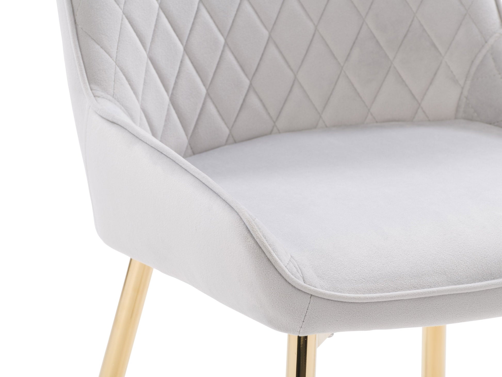 Light grey velvet dining chairs, set of 2, with tufted backrest, gold metal legs, and contemporary design. Perfect for modern dining rooms or kitchens. Luxurious and elegant seating solution.