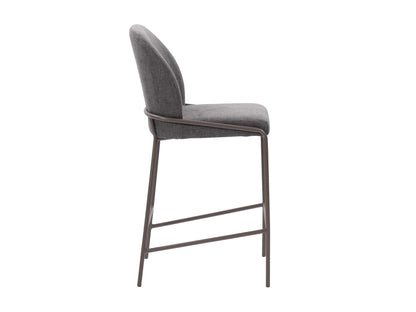 Dark grey modern bar stool with sleek metal legs, cushioned seat, and curved backrest; ideal for contemporary kitchen or bar settings.