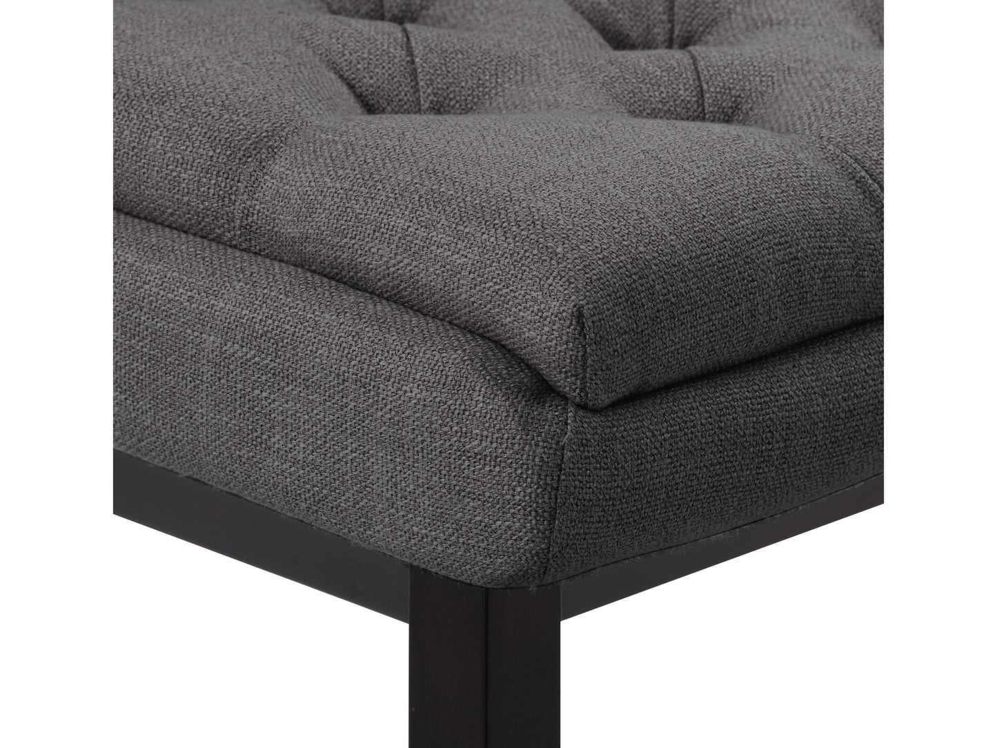 Dark grey button tufted bar stools with wooden legs and footrest, featuring plush fabric upholstery and a classic design, perfect for modern and contemporary kitchen or bar settings.