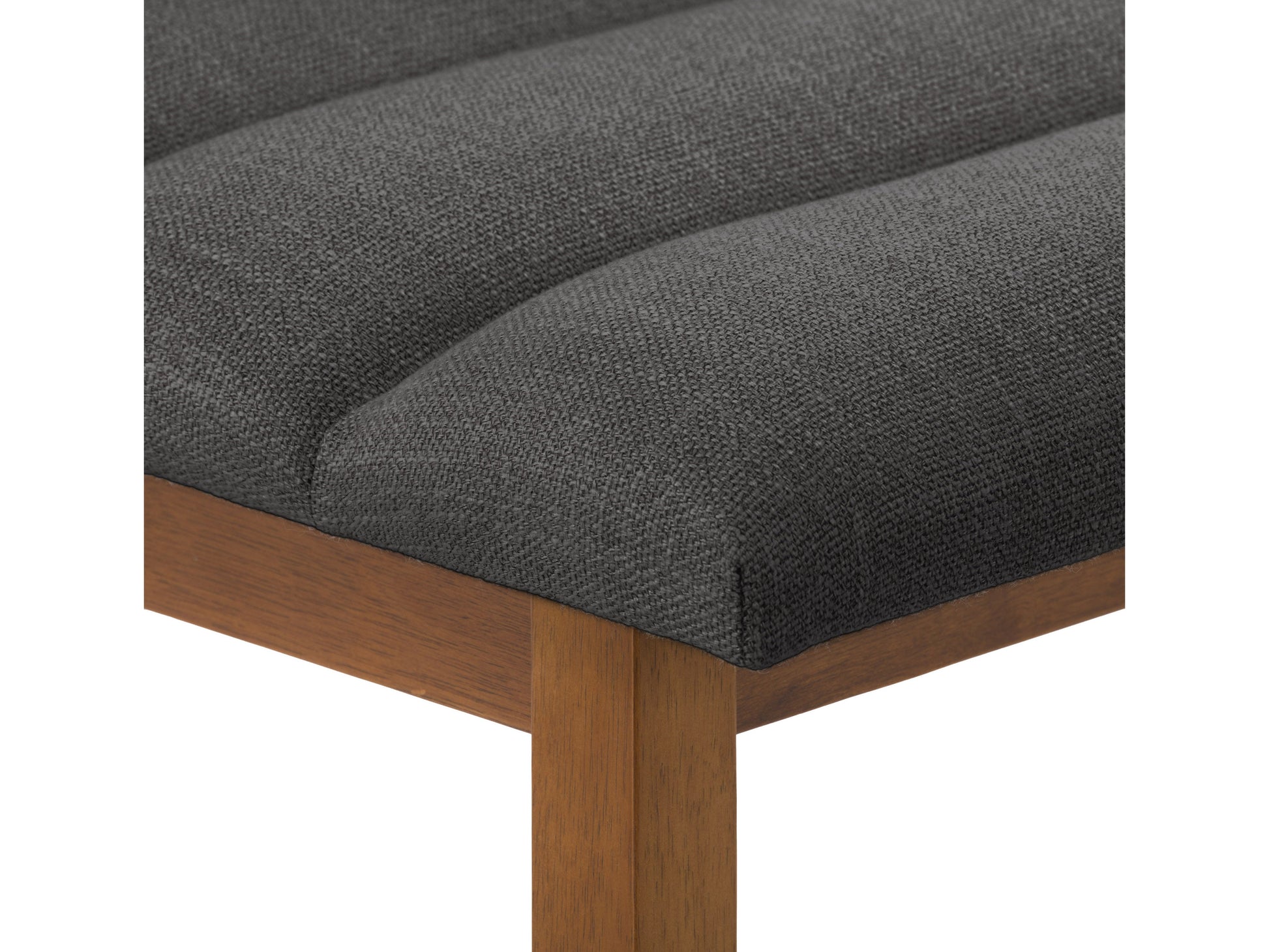 Dark grey channel tufted bar stool with plush velvet upholstery, sleek black metal legs, and a comfortable, modern design perfect for kitchen counters or home bars.