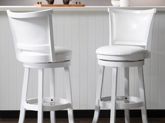 White bar height bar stools set of 2, featuring sleek chrome legs, cushioned seats with white faux leather upholstery, and footrests for added comfort, perfect for modern kitchen or bar settings.