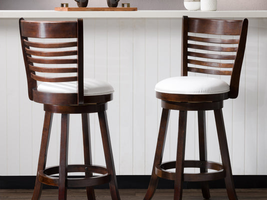 White bar height bar stools set of 2, featuring sleek chrome legs, cushioned seats with white faux leather upholstery, and footrests for added comfort, perfect for modern kitchen or bar settings.