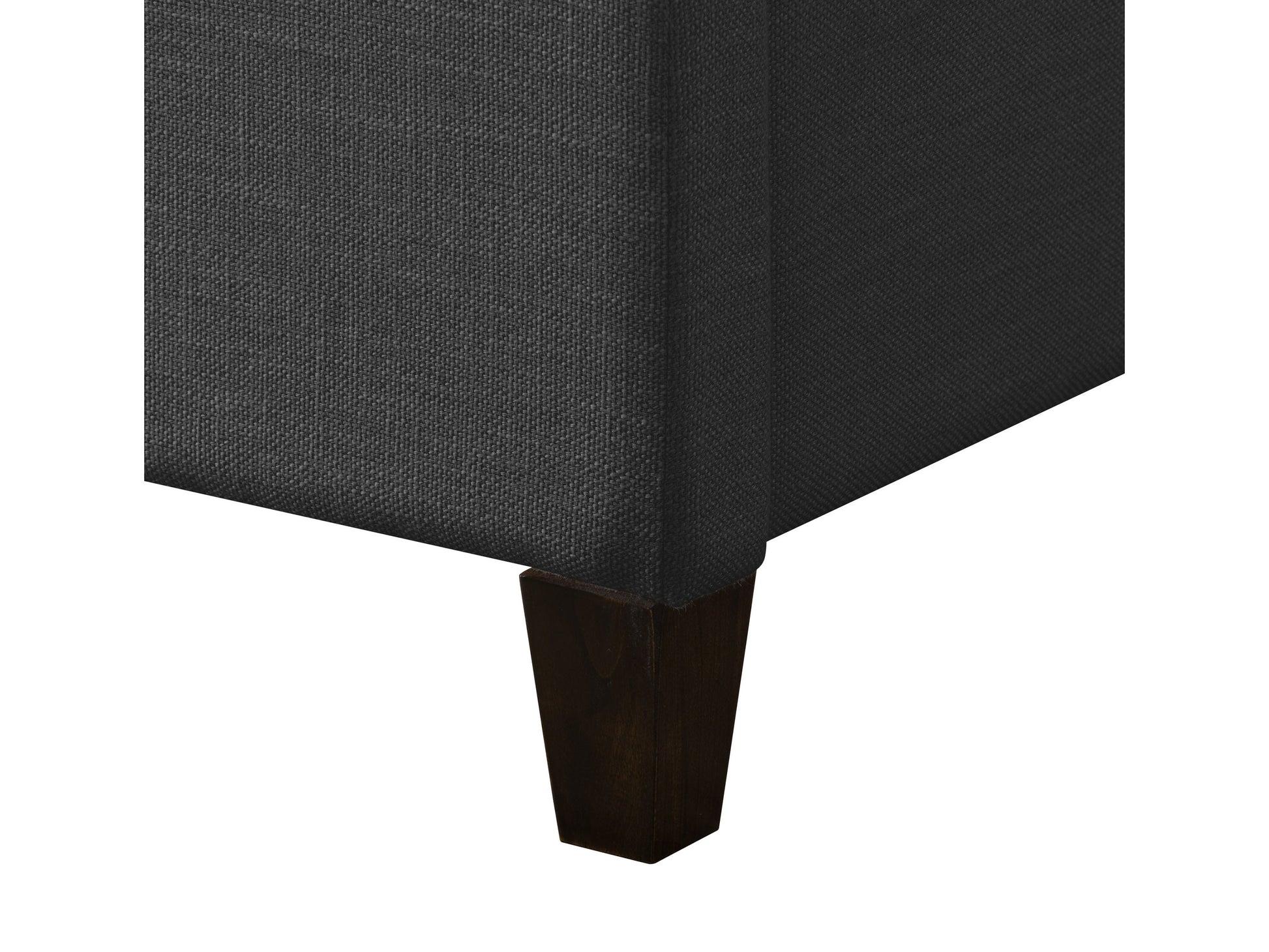 Dark grey upholstered queen bed with tufted headboard, soft fabric texture, and sturdy wooden frame. Ideal for modern bedrooms, offering comfort and style.