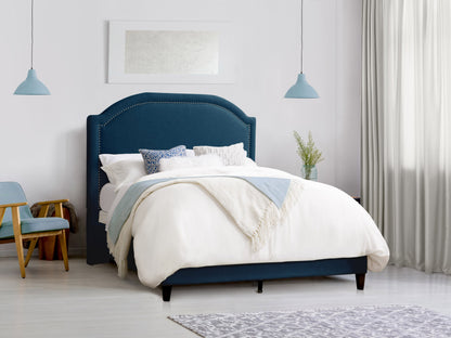 Navy blue upholstered queen bed with tufted headboard, wooden legs, and soft velvet fabric. Elegant design perfect for modern bedrooms.