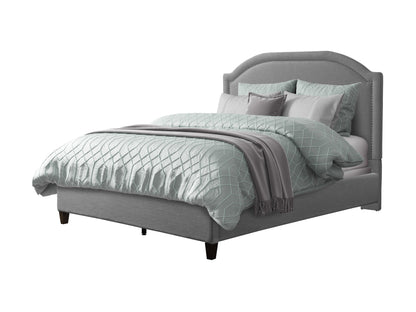 Grey upholstered king bed with tufted headboard, wooden legs, and soft fabric finish. Ideal for modern bedrooms, offering comfort and style.