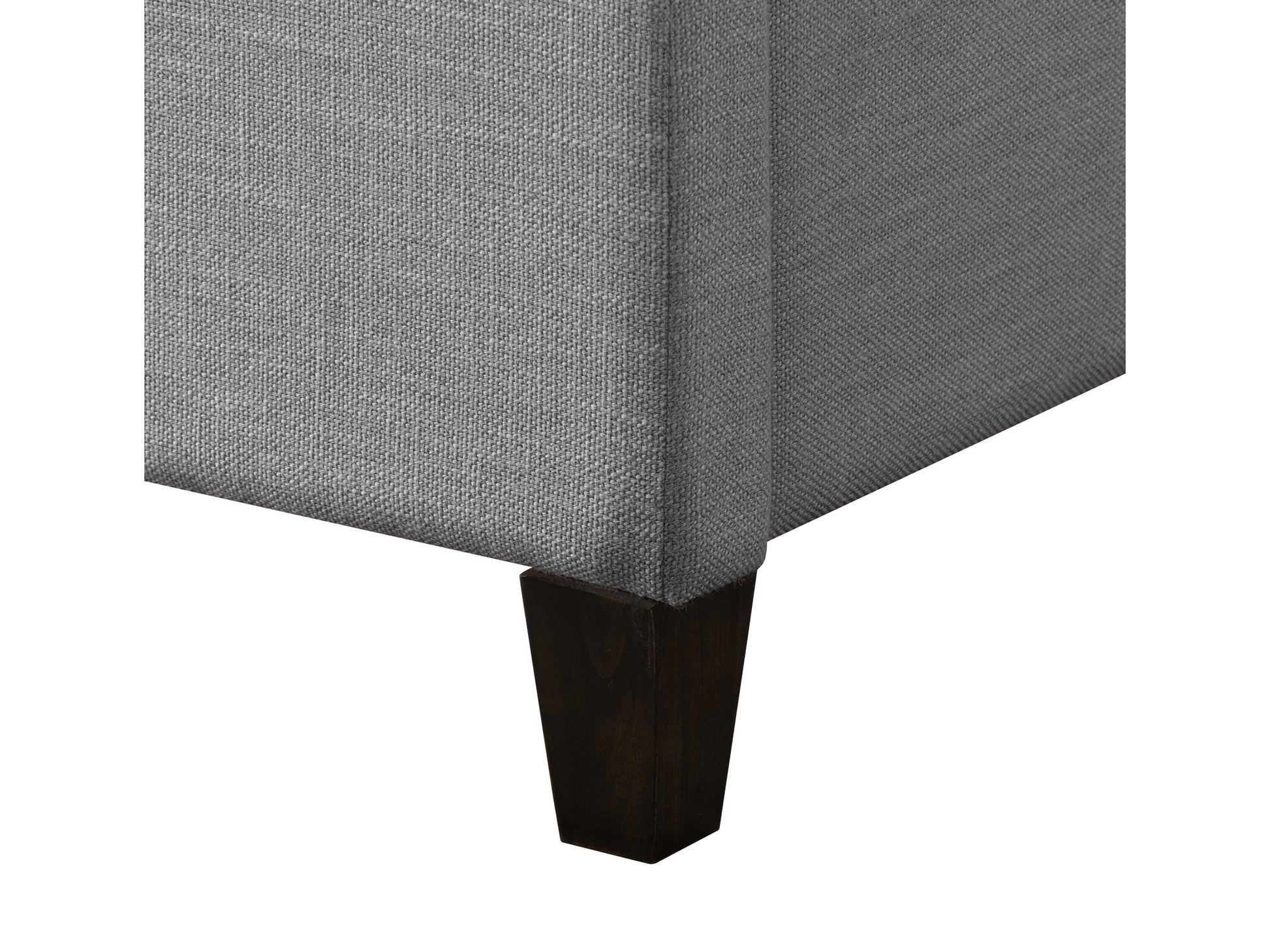 Grey upholstered queen bed with tufted headboard, soft fabric finish, and sturdy wooden legs. Ideal for modern bedrooms seeking comfort and style.
